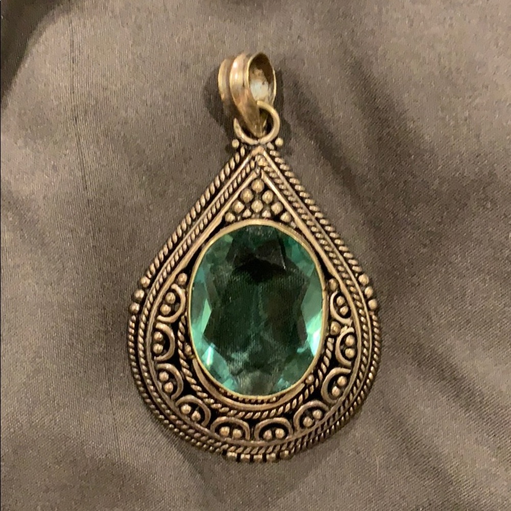 Antique silver pendant with green stone